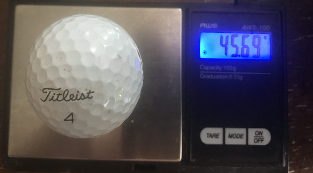 1 golf ball on a weight scale